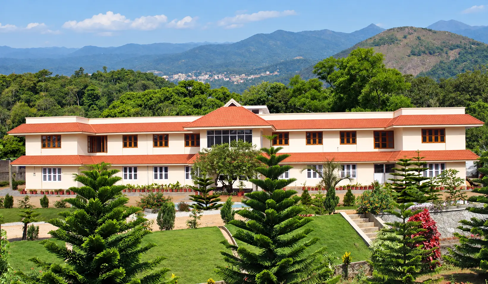 Navadarsanagram centre and gardens with the Idukki hills behind